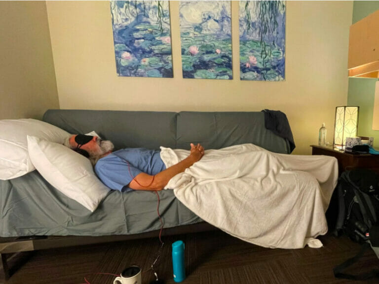 Person lying on a couch in a study suite